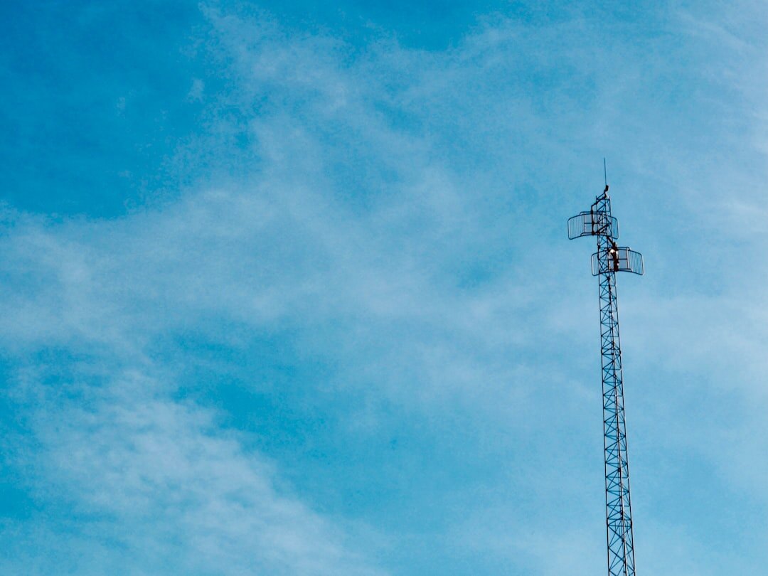 Broadcast transmission antenna tower against a blue sky