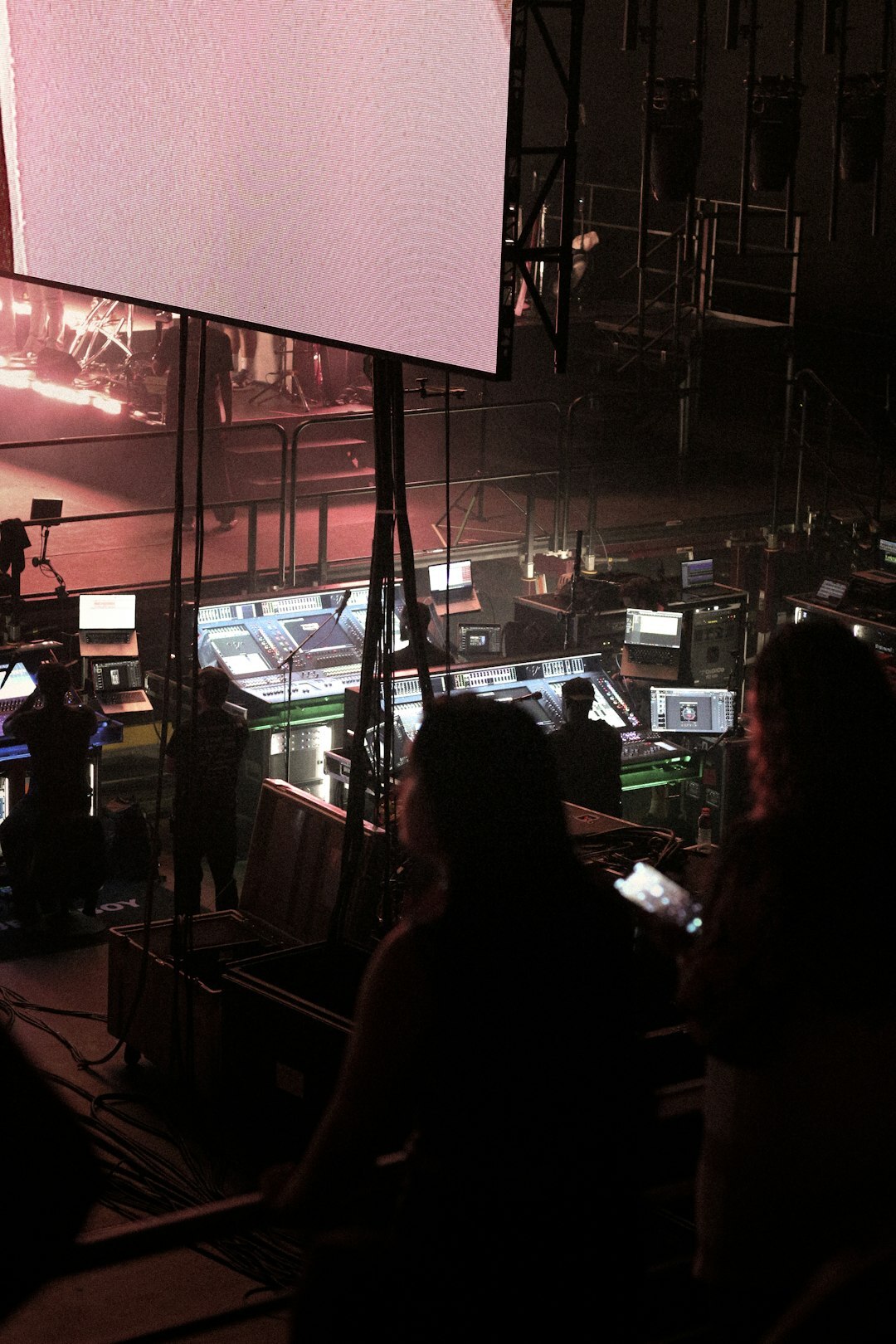 Broadcast control room with technicians monitoring signal screens